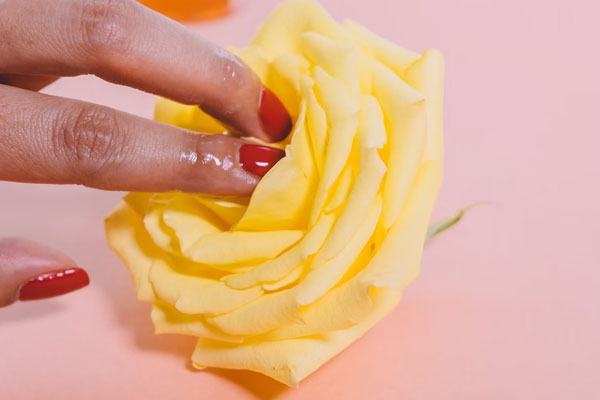 sexy fingers playing with flowers