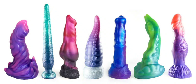Fantasy dildos collection in various mythical shapes and colours displayed on a shelf