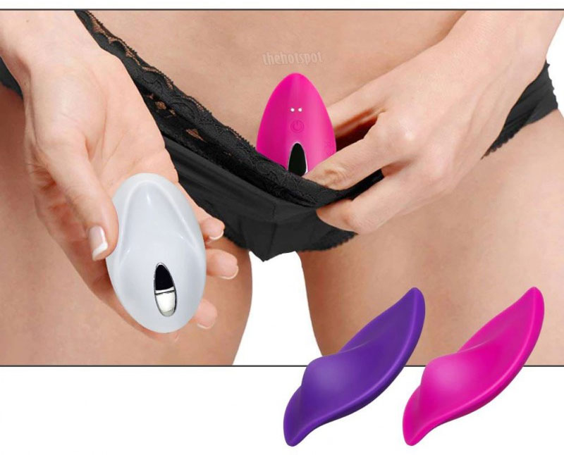 a person holding a vibrator pushing buttons